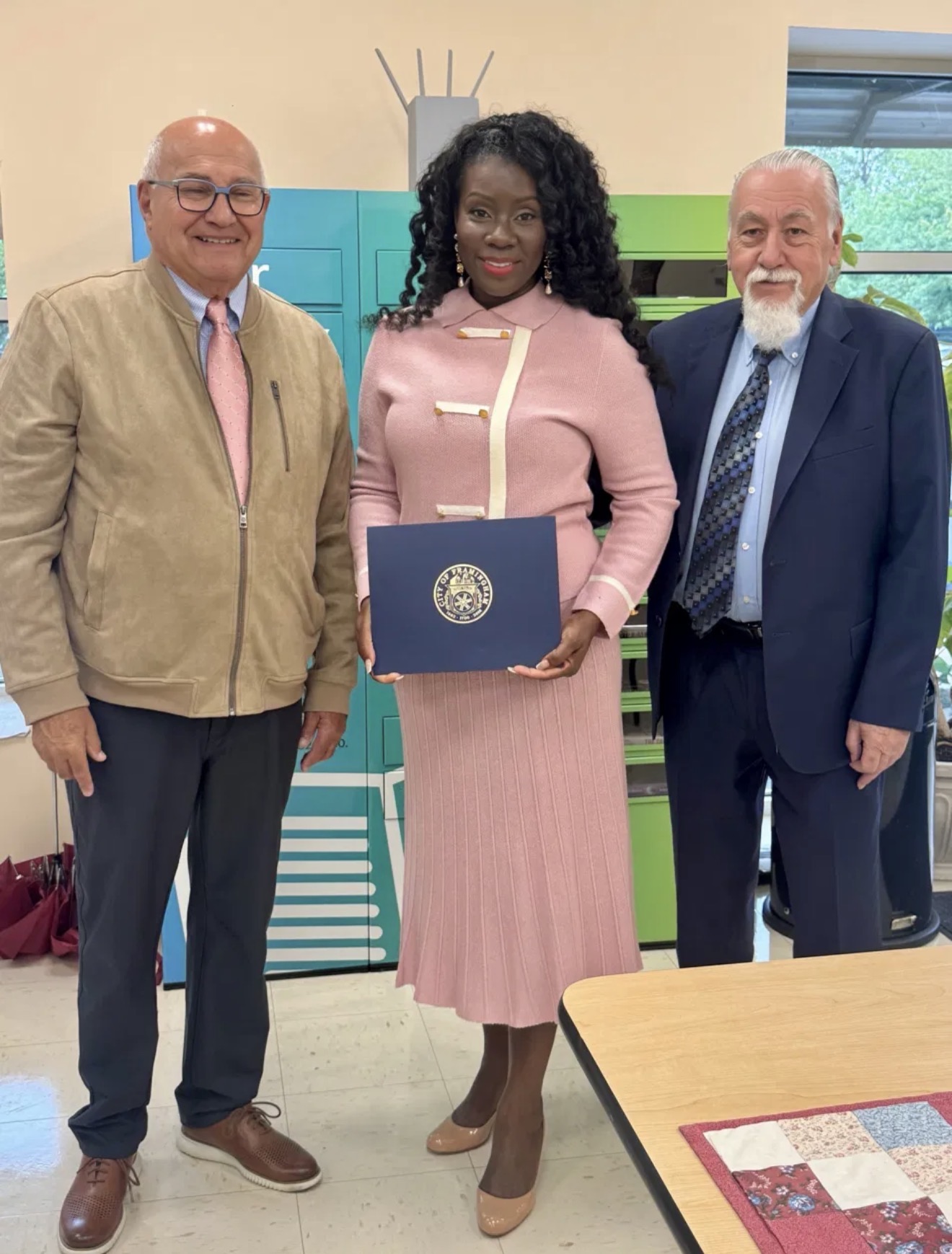 Cynthia with her husband and the Mayor of Framingham at the city’s International Widows Day observance